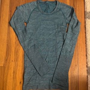 Teal lululemon long sleeve, with thumb holes.